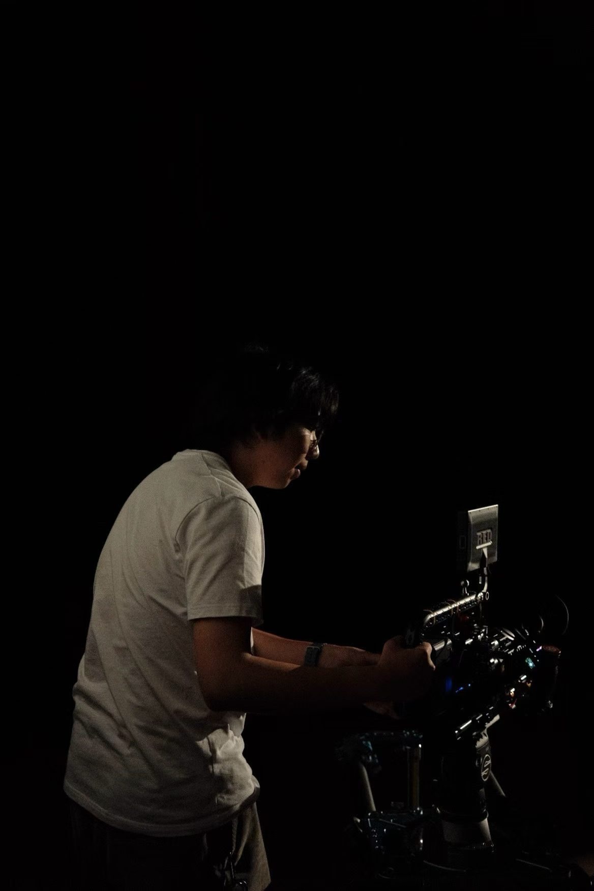 Anson Xiang operating a cinema camera on set