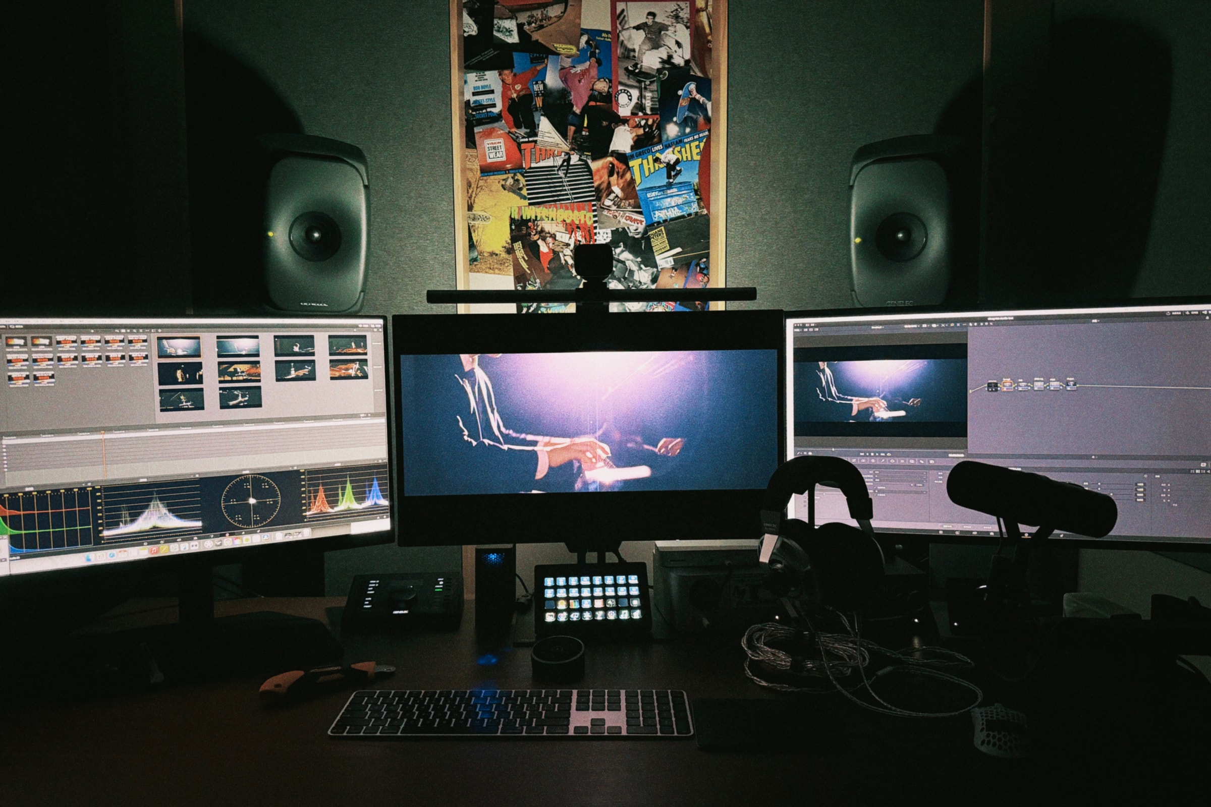 Anson’s editing and color-grading workspace, with three displays, studio monitors, and a film in progress